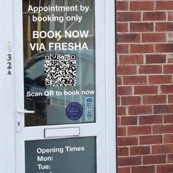 The clinic door at 32A Barnsley Road, with “Appointment by booking only” on the glass
